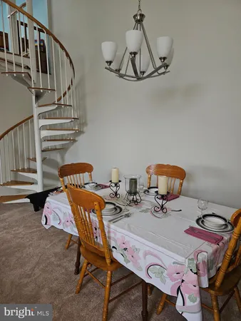 a balcony with table and chairs