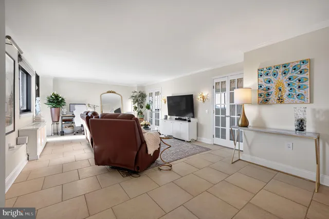a view of a hallway with closet and a potted plant