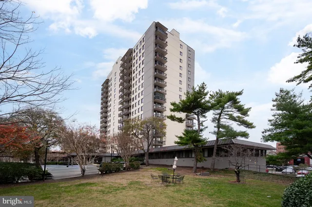 a swimming pool with outdoor seating and yard
