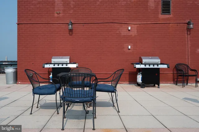 a front view of a house with a yard and fountain