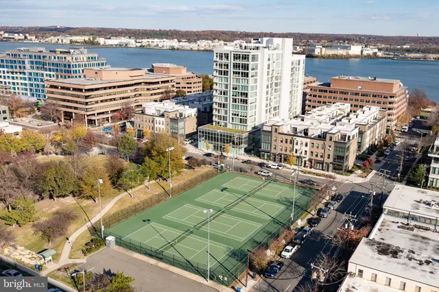 a view of a patio with table and chairs and potted plants