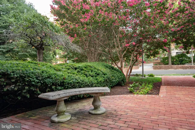 a view of swimming pool with outdoor seating and city view