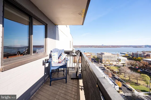 a view of a balcony with chairs