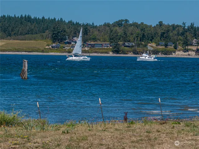 a view of a swimming pool with an outdoor seating and yard
