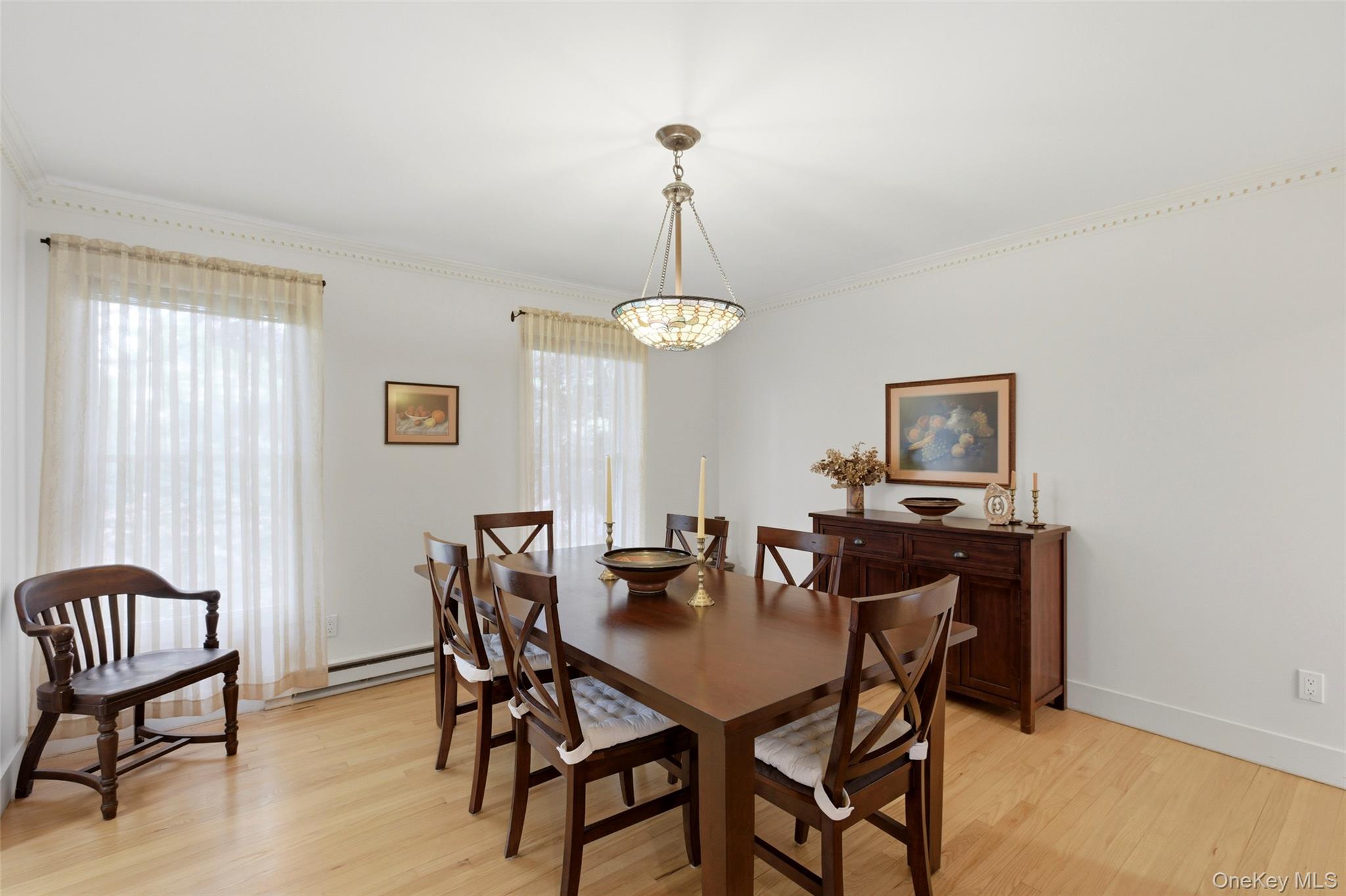 7 Gun Path Setauket, NY 11733 - Photo 9 of 34 a view of a dining room with furniture and window