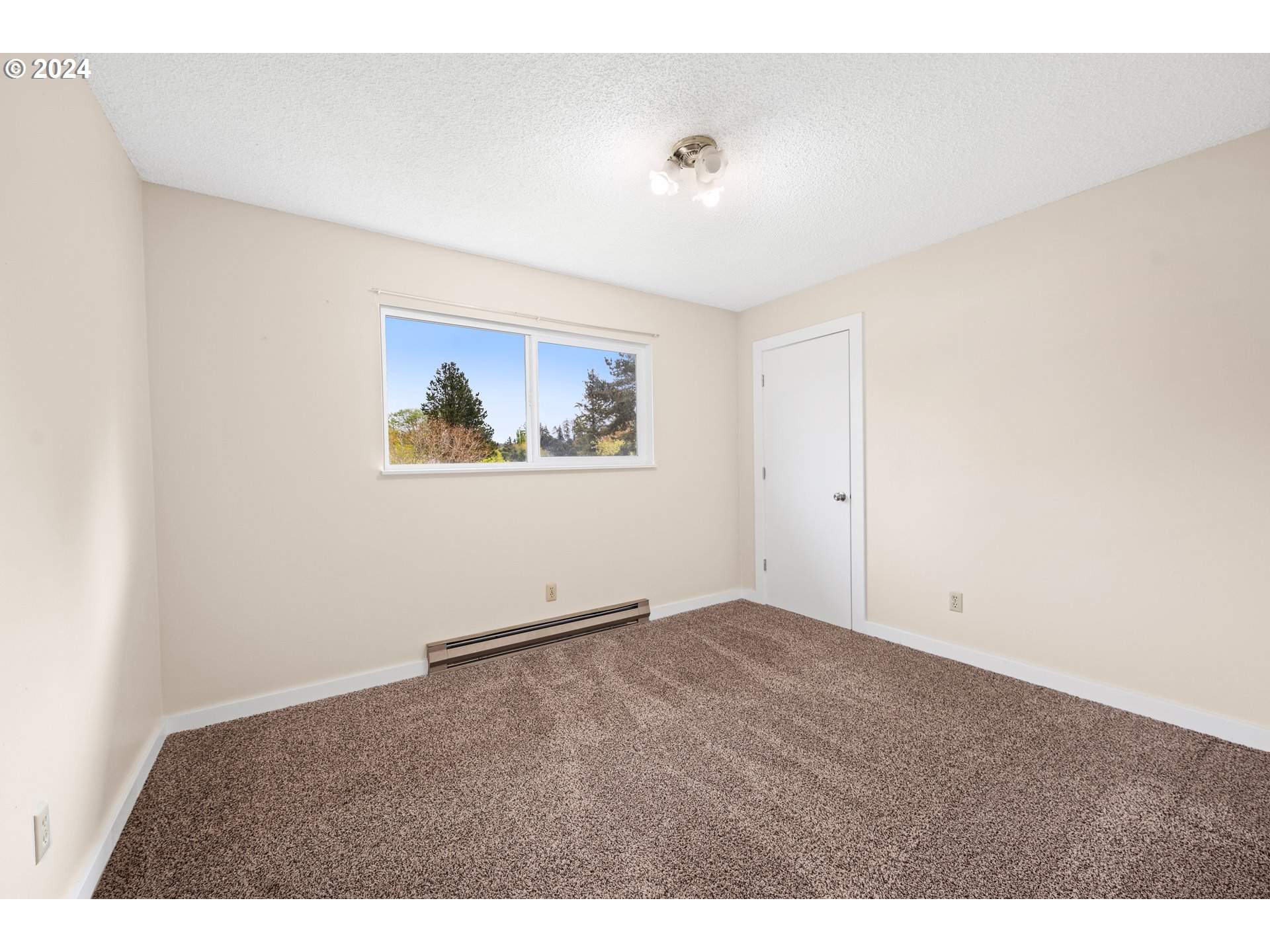 91897 Ridge Road Warrenton, OR 97146 - Photo 13 of 24 a view of an empty room with a window