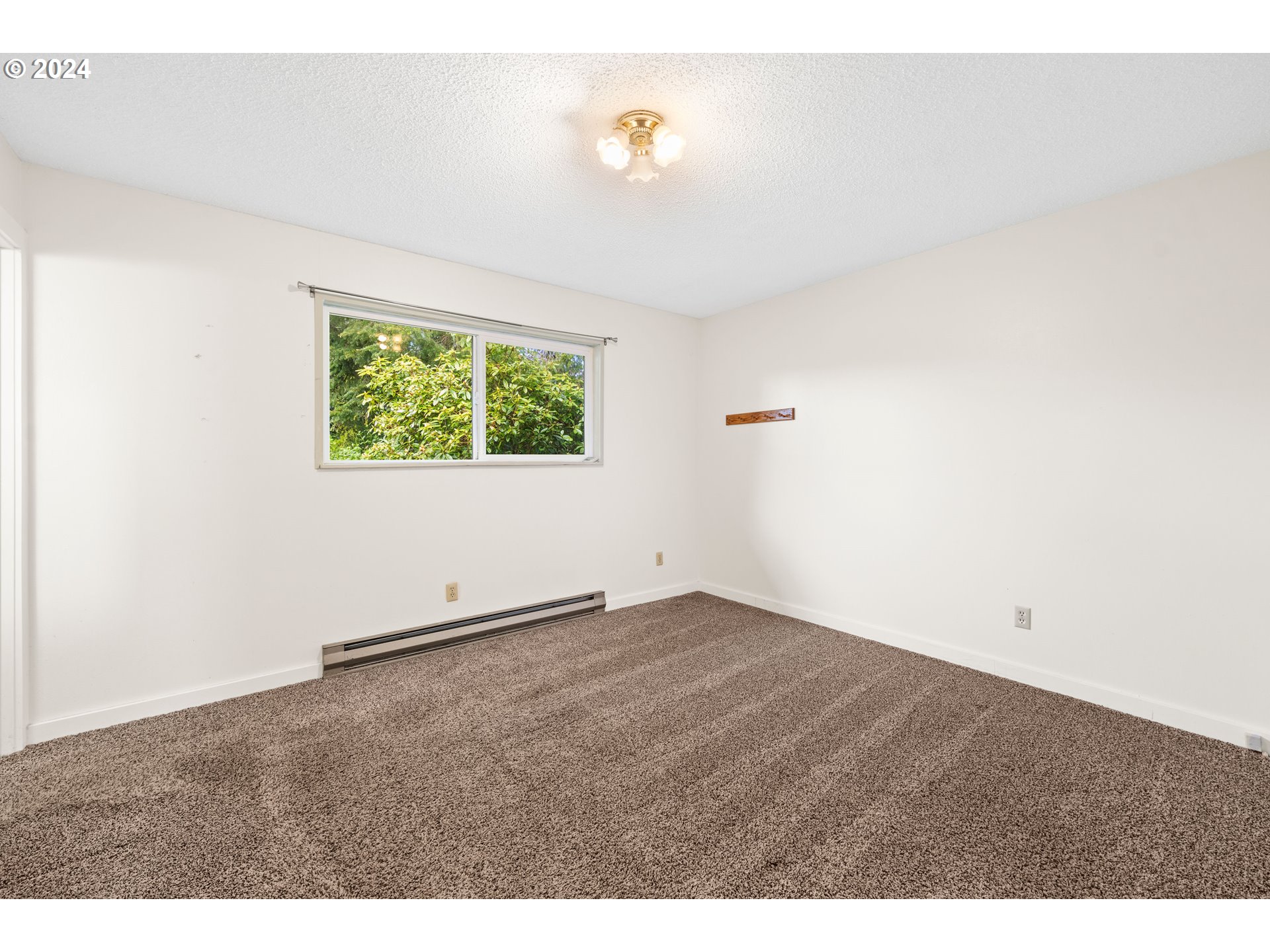 91897 Ridge Road Warrenton, OR 97146 - Photo 14 of 24 a view of an empty room with a window