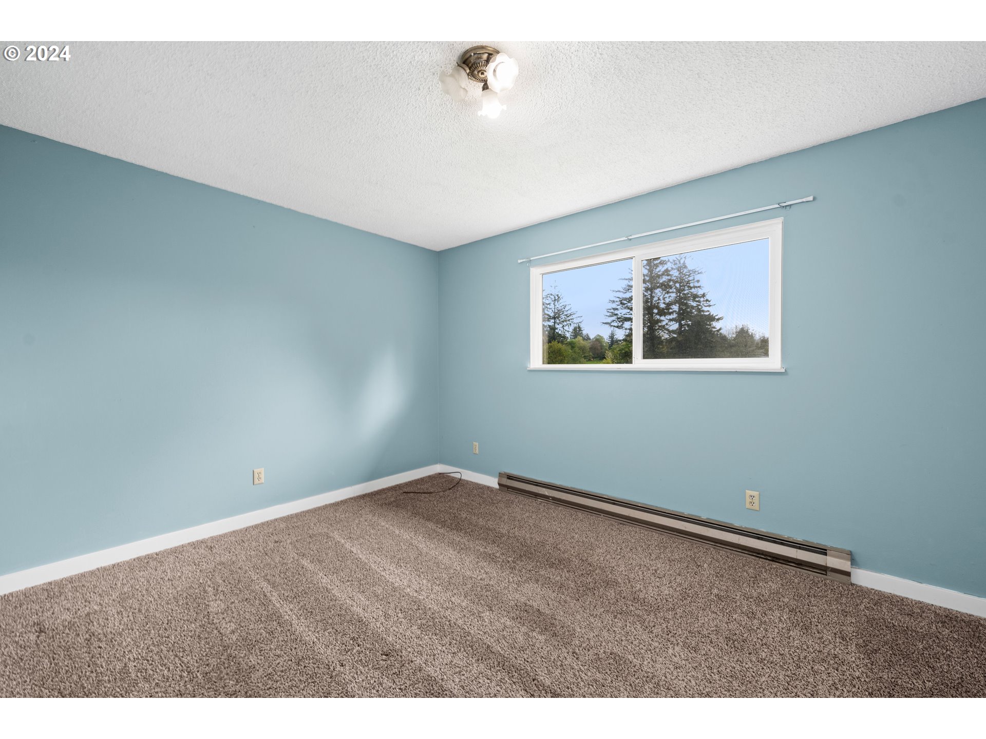 91897 Ridge Road Warrenton, OR 97146 - Photo 16 of 24 a view of an empty room with a window