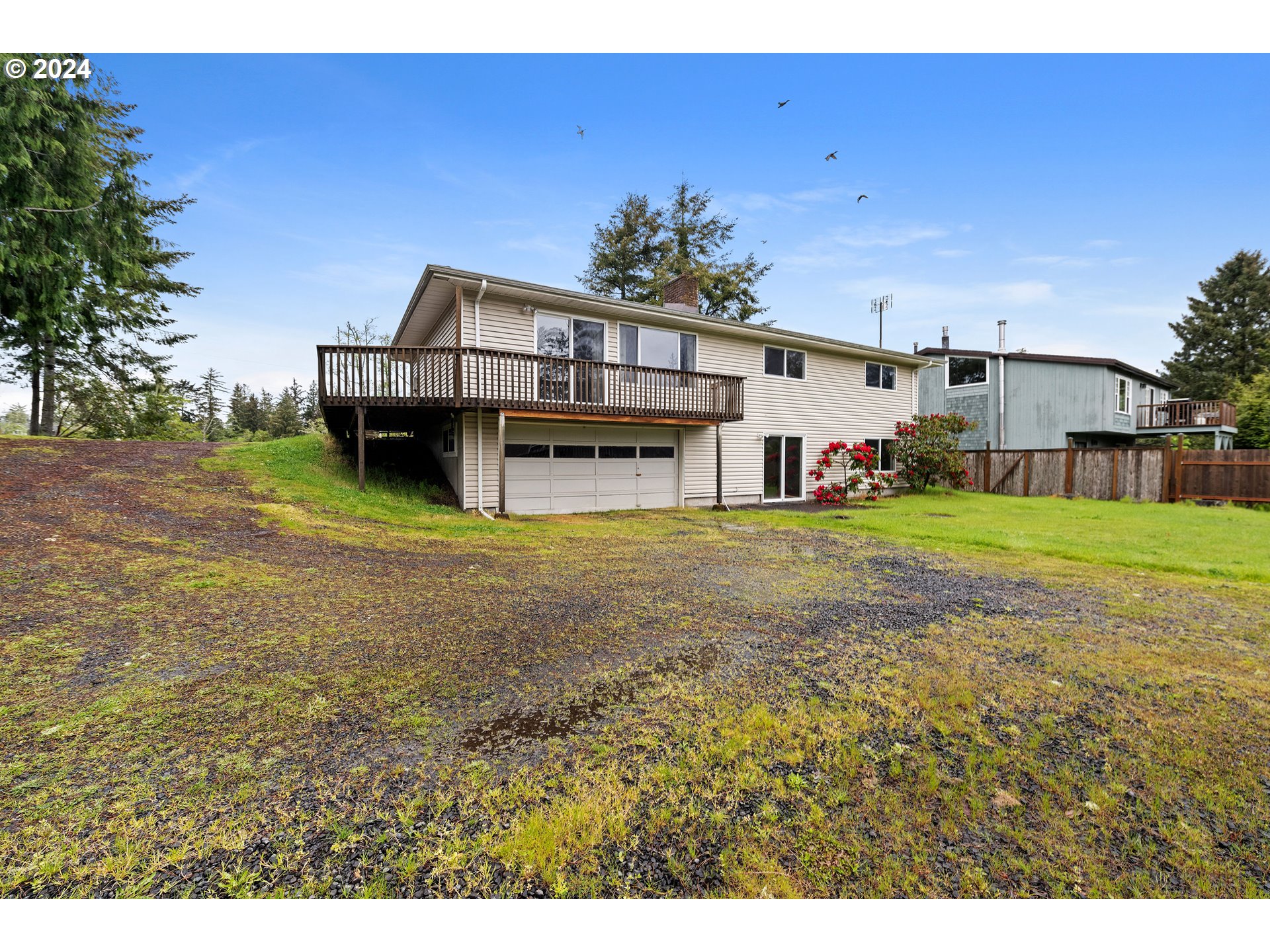 91897 Ridge Road Warrenton, OR 97146 - Photo 21 of 24 a view of a house with a yard