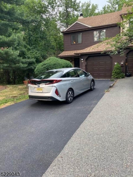 a car parked in front of a house