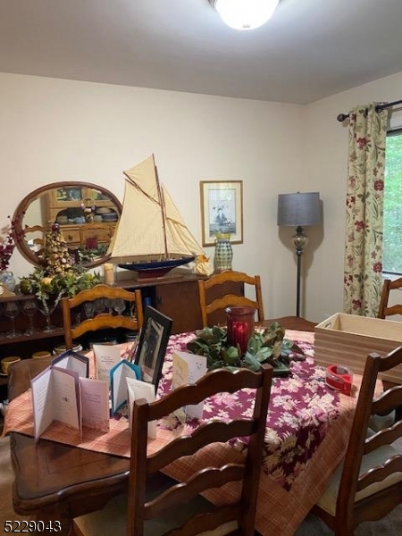 39 Patriots Road Morris Plains, NJ 07950 - Photo 4 of 14 a living room with furniture and a chandelier