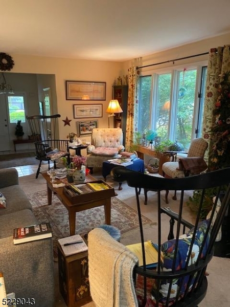 39 Patriots Road Morris Plains, NJ 07950 - Photo 5 of 14 a living room with furniture a window and a table