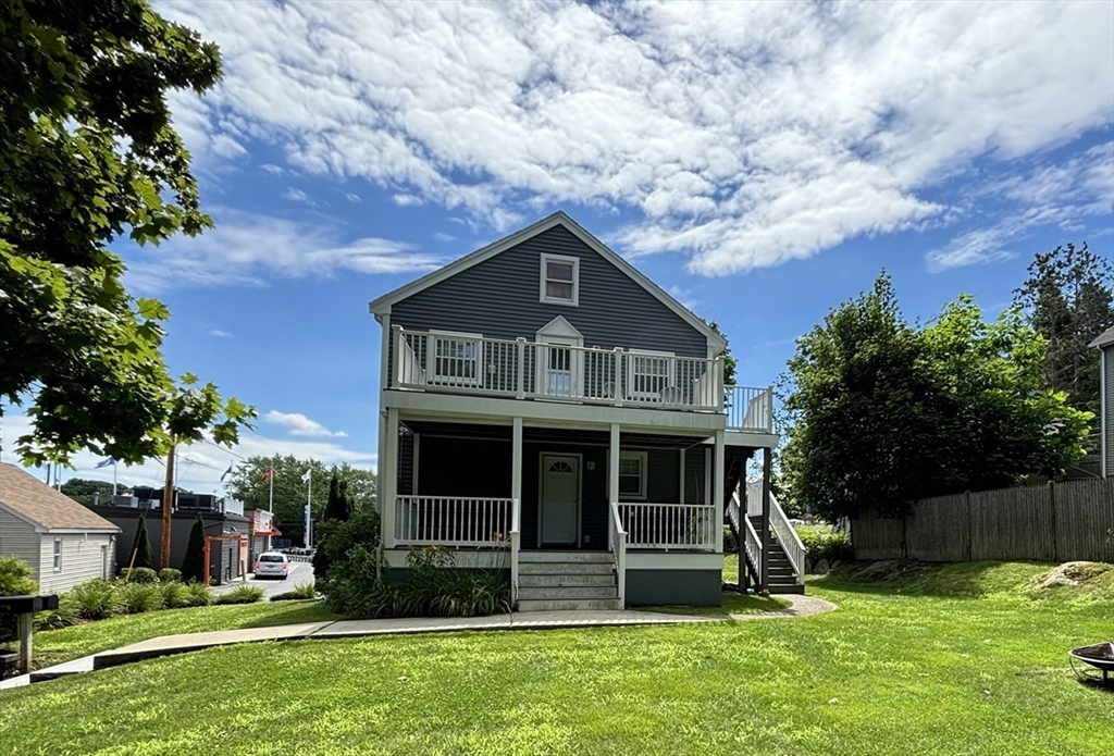 a front view of a house with a yard
