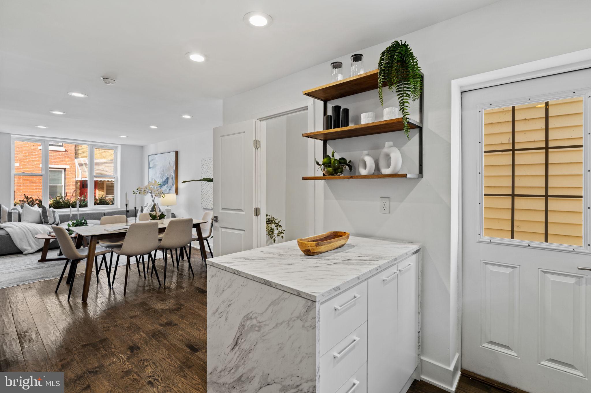 1629 South Camac Street Philadelphia, PA 19148 - Photo 16 of 34 an open kitchen with a table and chairs