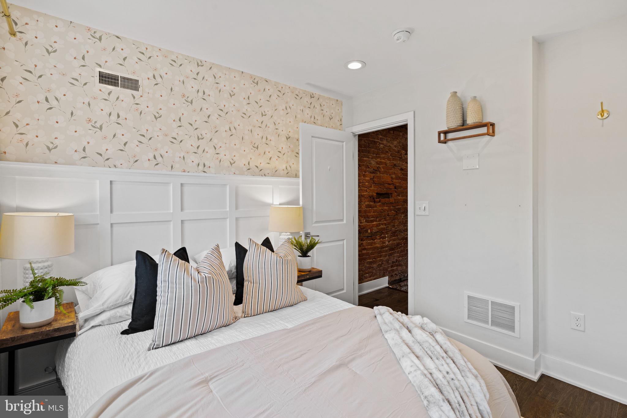 1629 South Camac Street Philadelphia, PA 19148 - Photo 21 of 34 a bedroom with a bed and a window