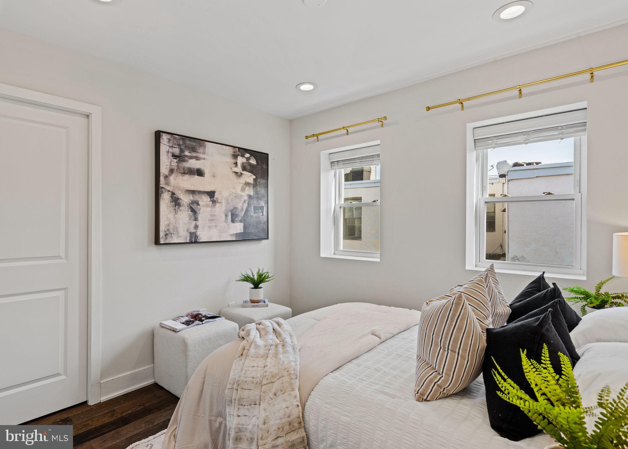 1629 South Camac Street Philadelphia, PA 19148 - Photo 23 of 34 a bedroom with bed couch and window