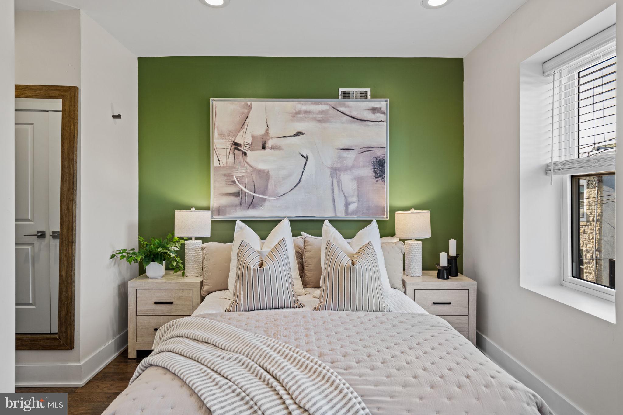 1629 South Camac Street Philadelphia, PA 19148 - Photo 28 of 34 a bedroom with a bed and window