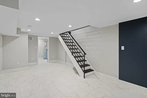 an entryway in a hall with a window