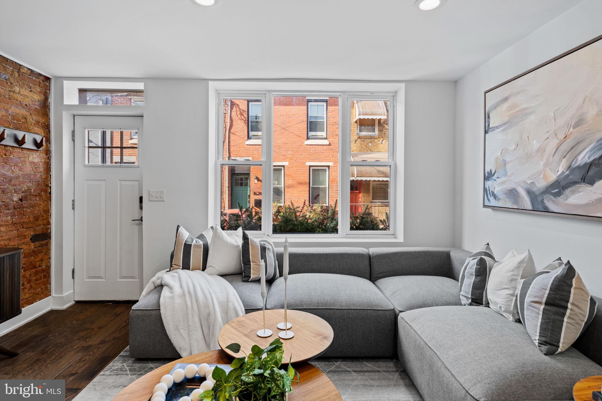 1629 South Camac Street Philadelphia, PA 19148 - Photo 4 of 34 a living room with furniture and a large window