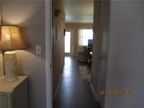 a view of hallway with wooden floor