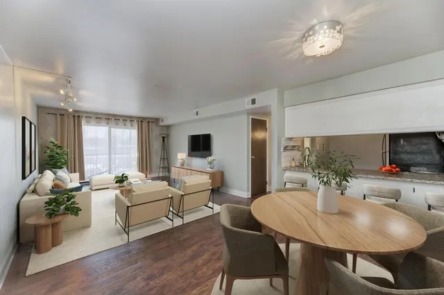 a view of a dining room with furniture window and outside view
