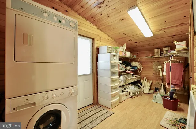 a bathroom with a granite countertop sink toilet and bathtub