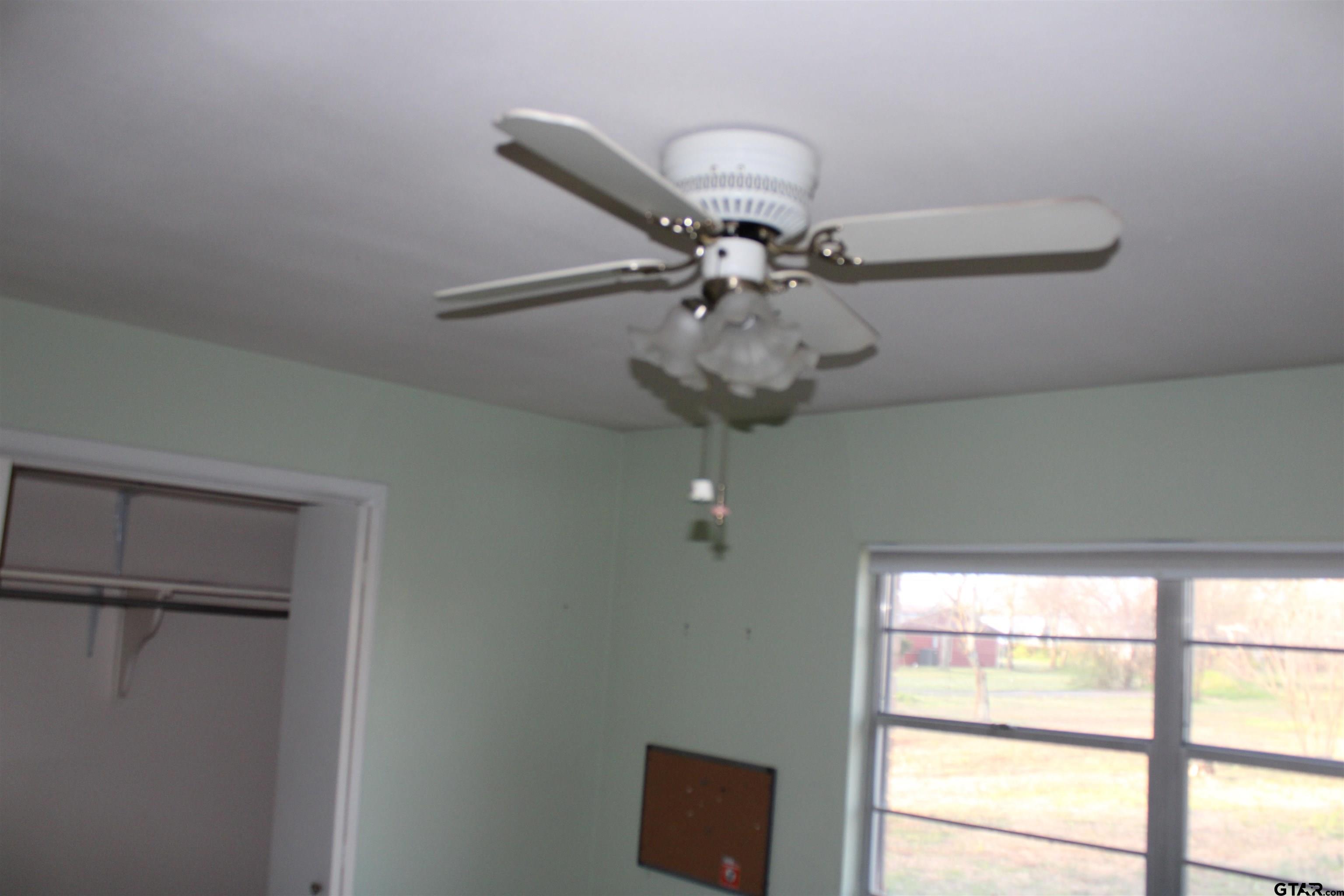 137 North Main Street Yantis, TX 75497 - Photo 11 of 22 a view of a chandelier fan in a room