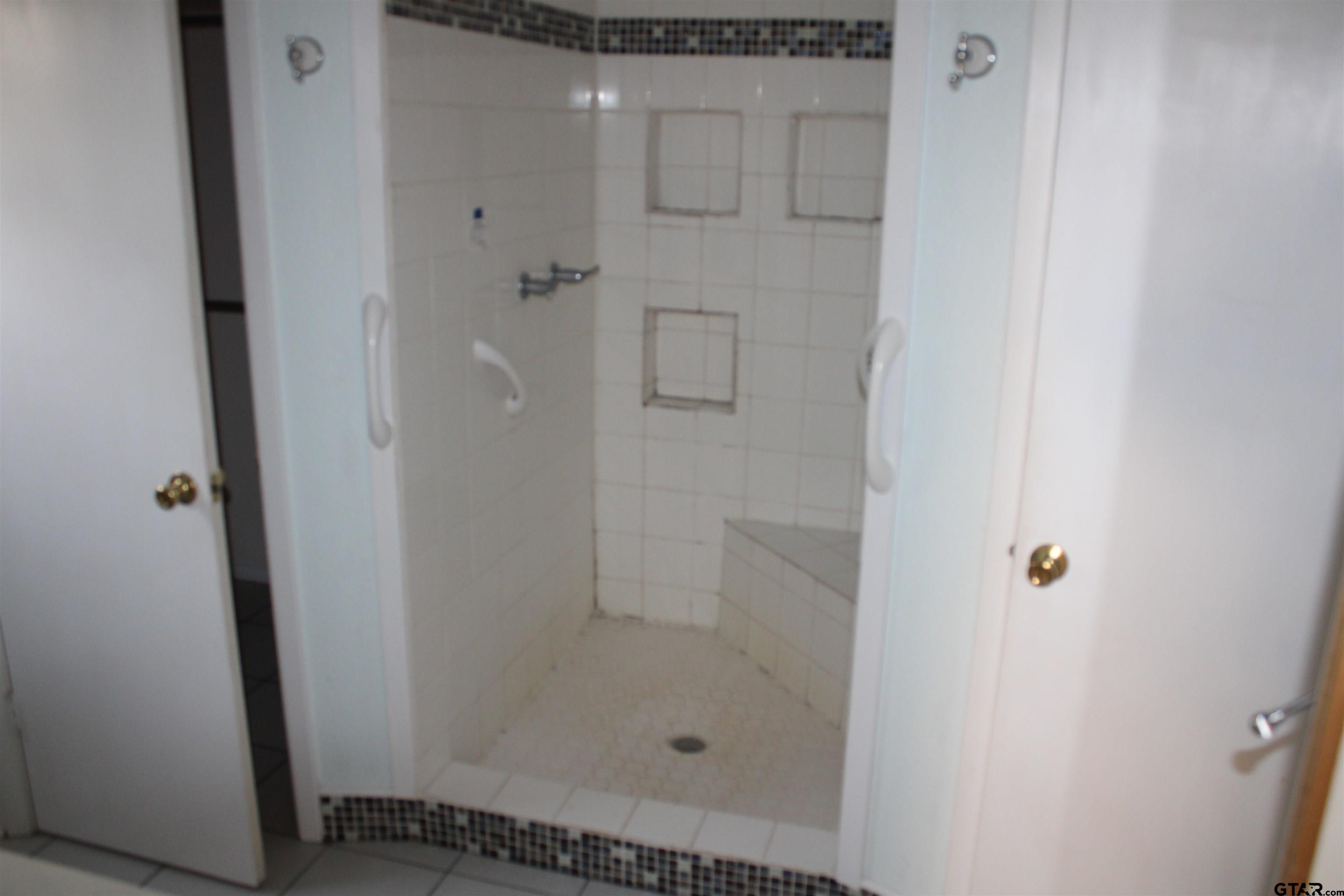 137 North Main Street Yantis, TX 75497 - Photo 13 of 22 a bathroom with a shower