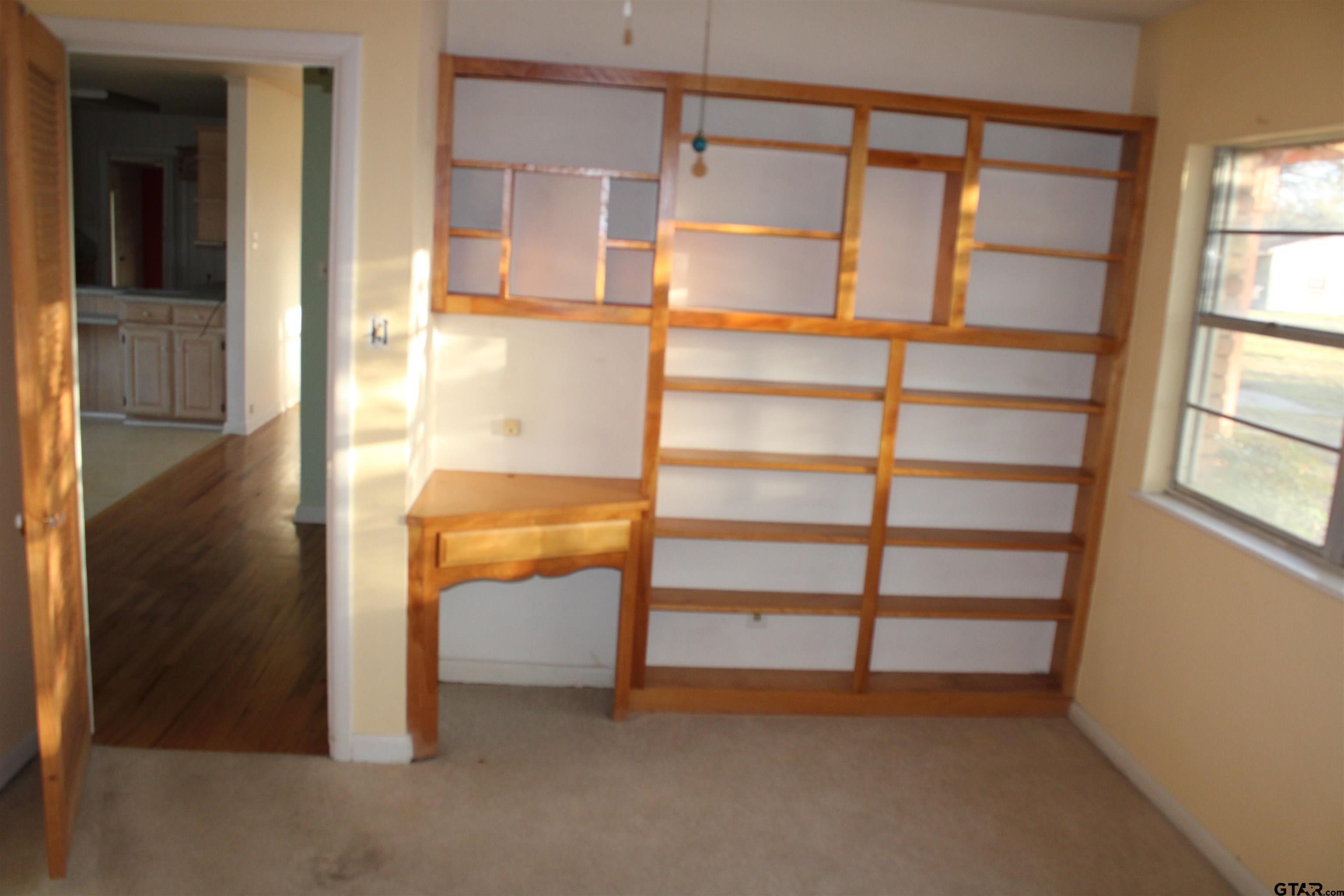 137 North Main Street Yantis, TX 75497 - Photo 16 of 22 a view of an empty room with a window