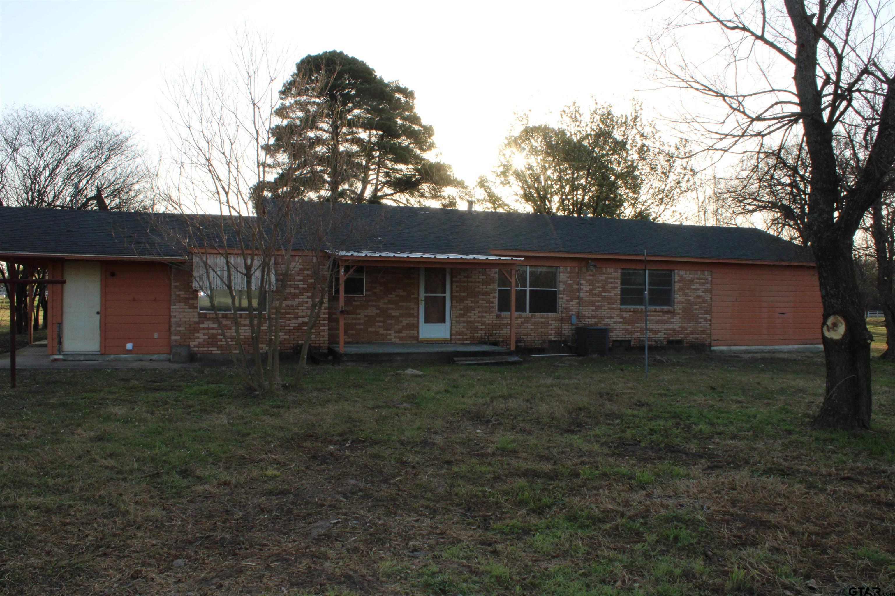 137 North Main Street Yantis, TX 75497 - Photo 17 of 22 a backyard of a house