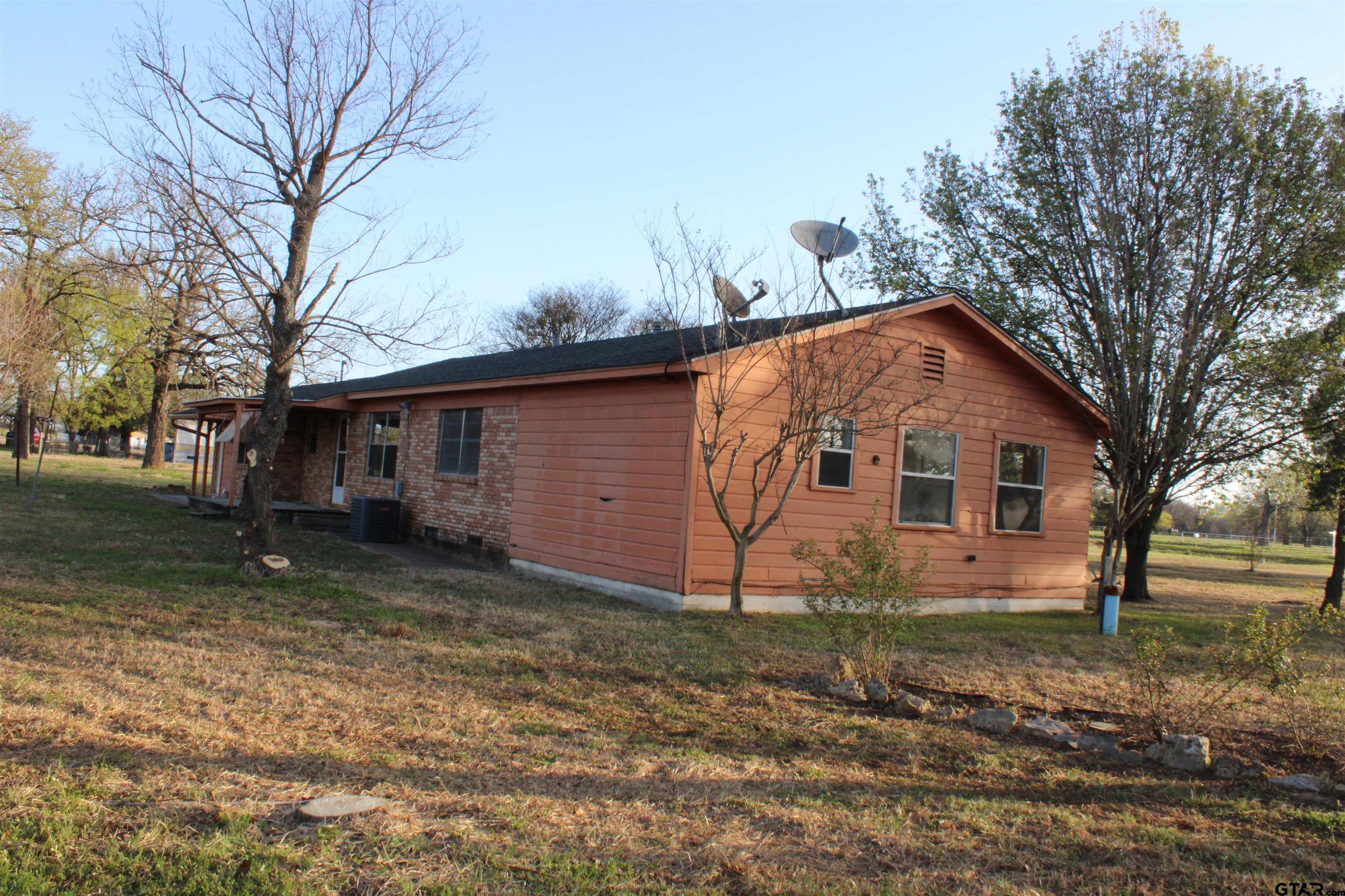 137 North Main Street Yantis, TX 75497 - Photo 18 of 22 a view of a house with a yard