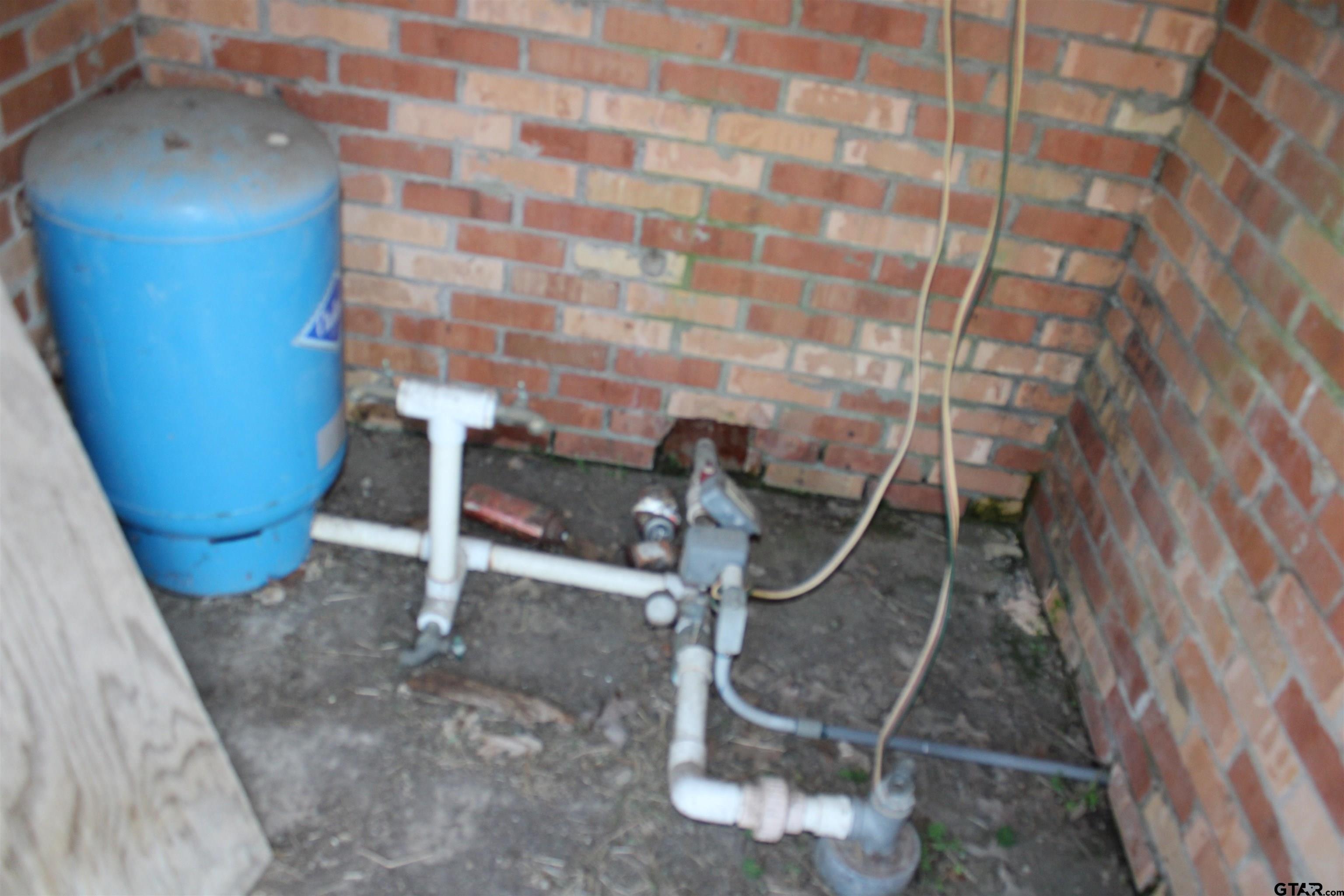 137 North Main Street Yantis, TX 75497 - Photo 20 of 22 a room with water heater and storage