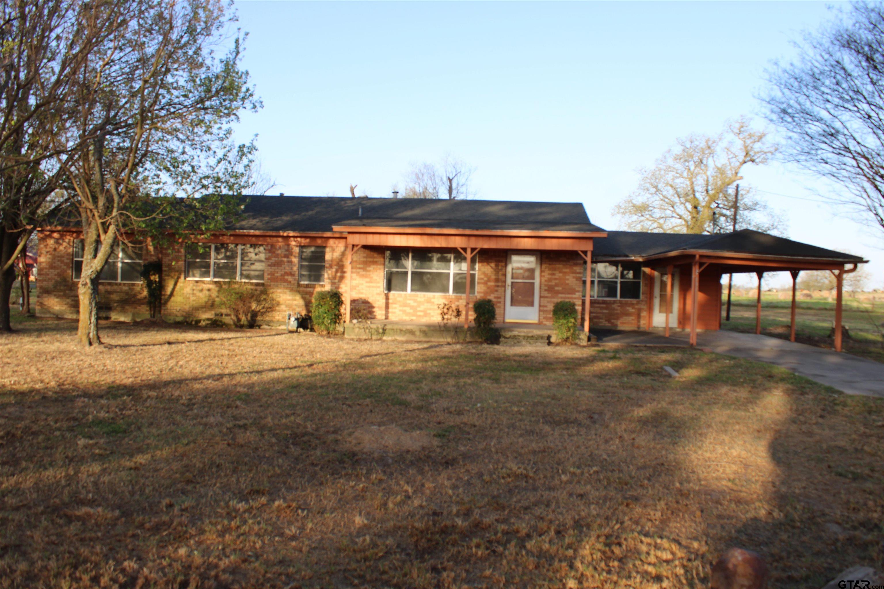 137 North Main Street Yantis, TX 75497 - Photo 3 of 22 a front view of a house with garden