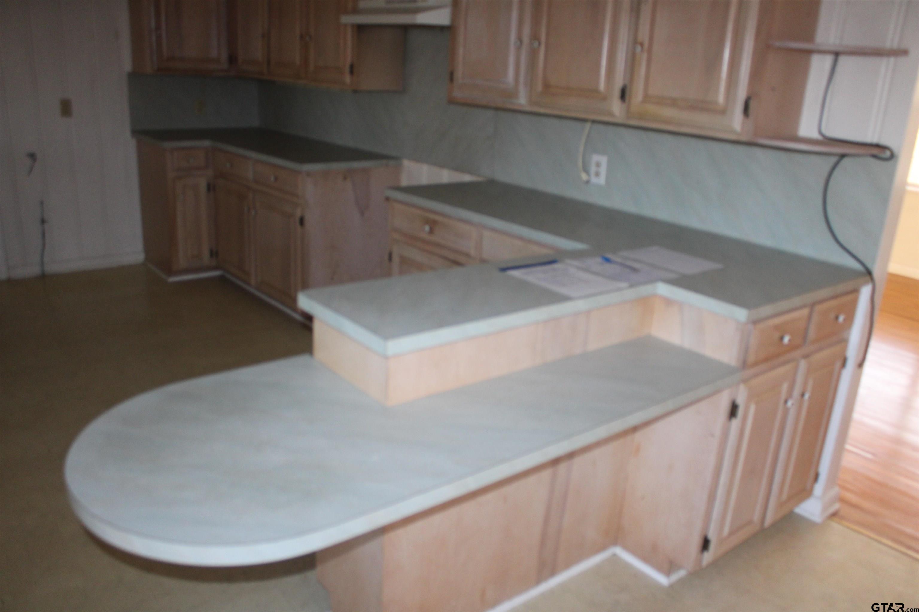 137 North Main Street Yantis, TX 75497 - Photo 6 of 22 a kitchen with a sink and cabinets