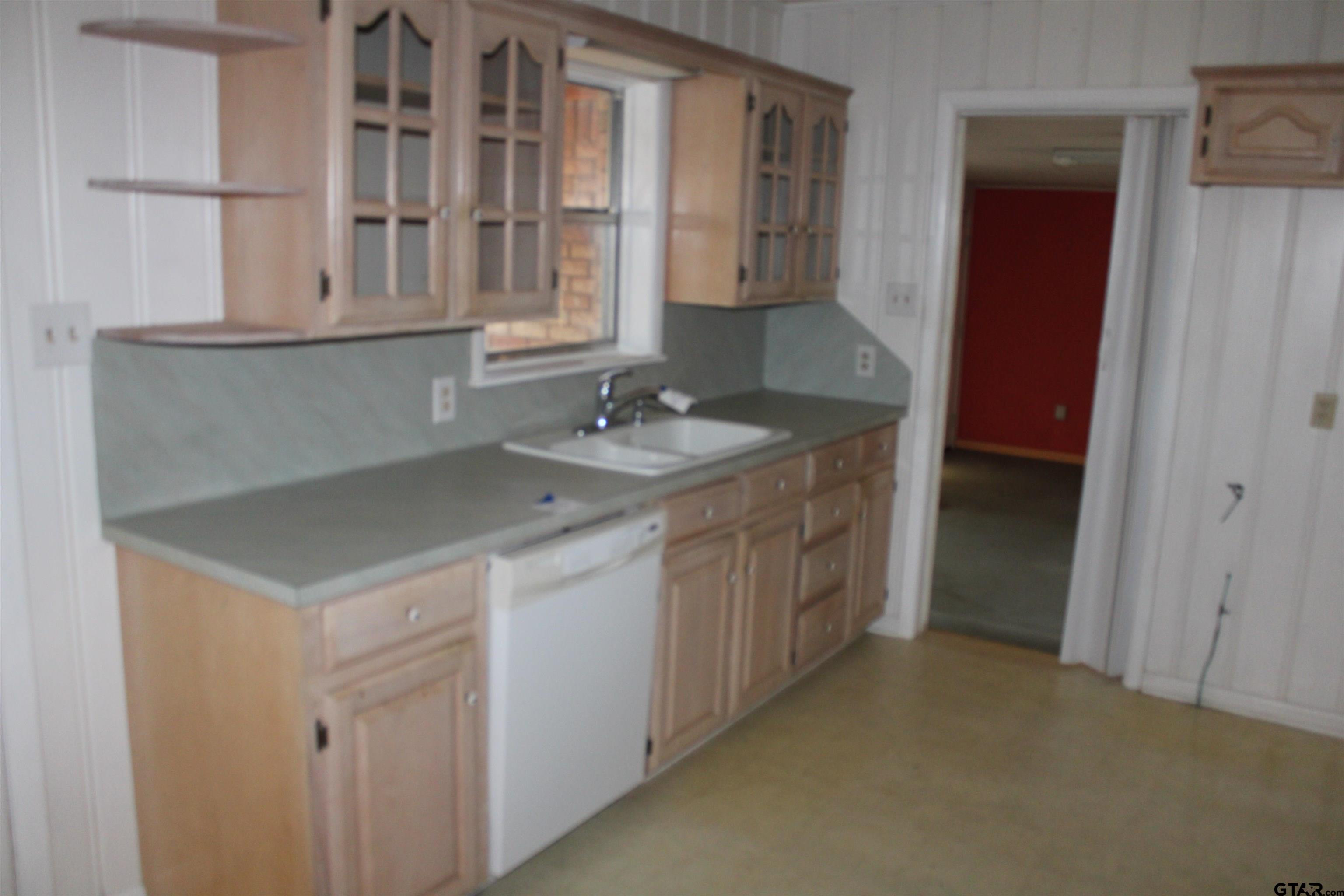 137 North Main Street Yantis, TX 75497 - Photo 7 of 22 a kitchen with a sink and cabinets