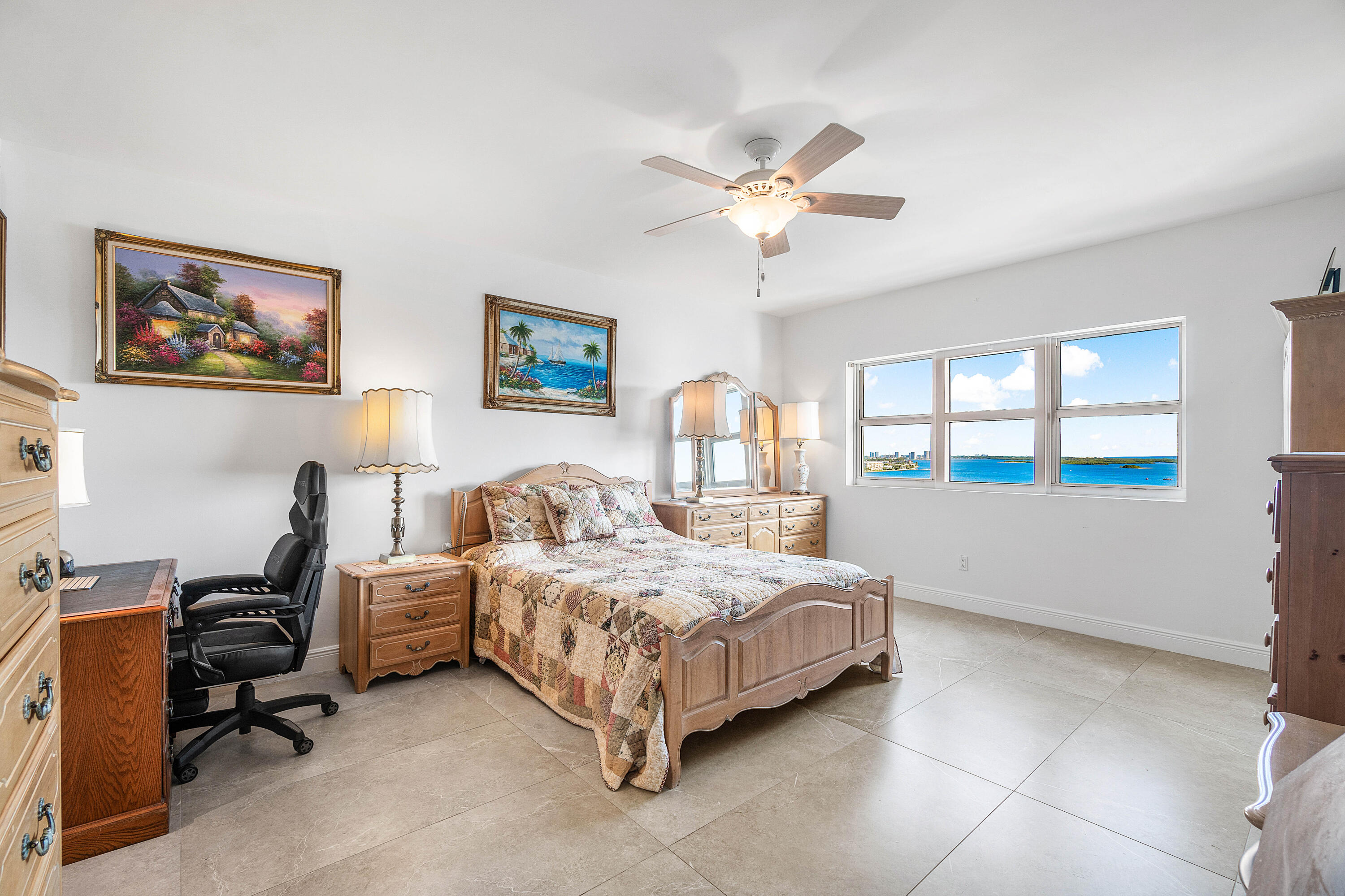 2650 Lake Shore Drive, Unit 1705 Riviera Beach, FL 33404 - Photo 11 of 35 a bedroom with a bed and a window