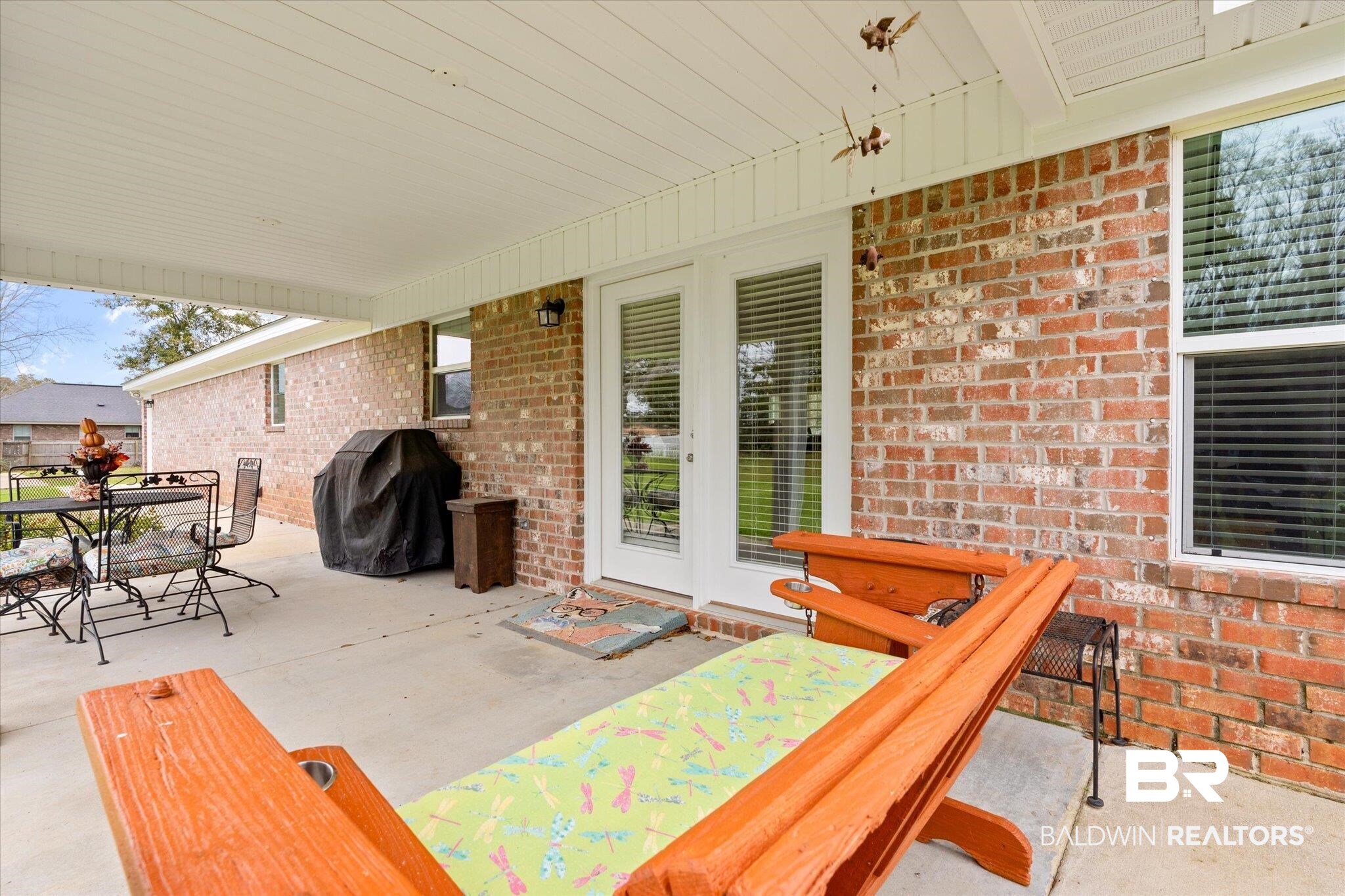 734 West Section Avenue Foley, AL 36535 - Photo 26 of 50 View of patio featuring area for grilling and outdoor dining space