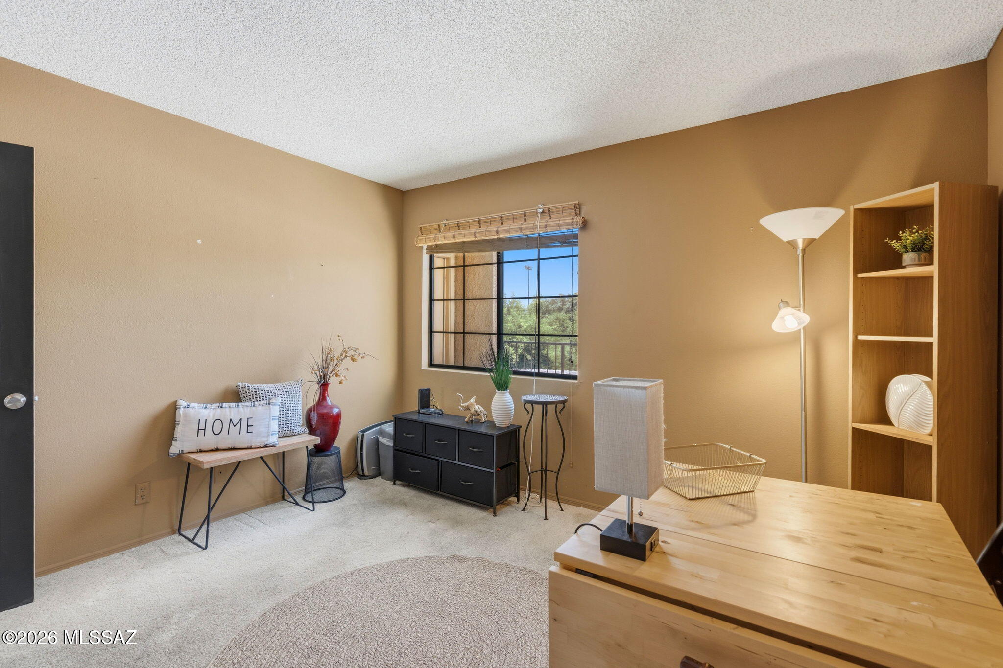 1200 East River Road, Unit G87 Tucson, AZ 85718 - Photo 20 of 30 a bedroom with a bed and a window