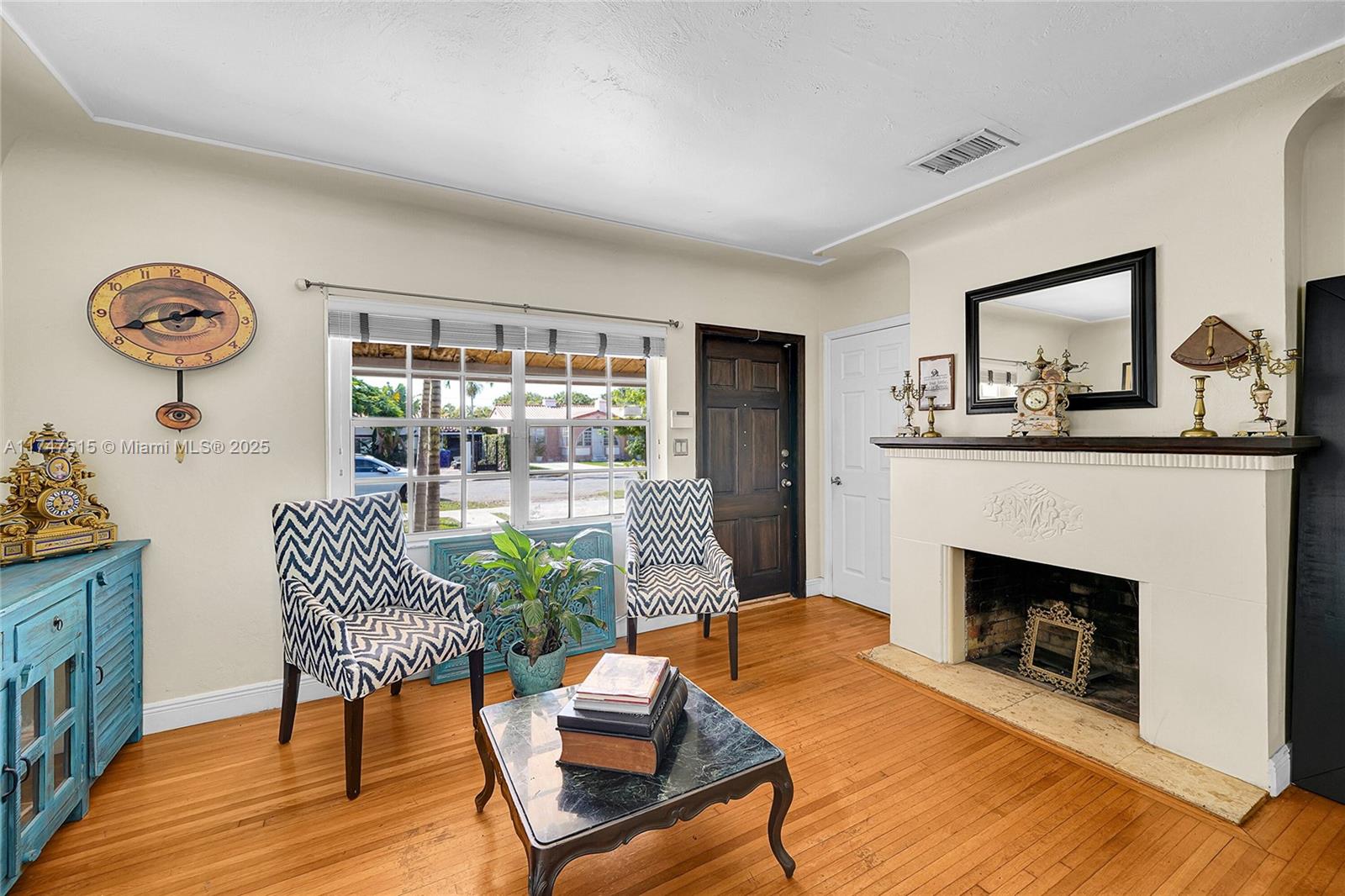 2271 Southwest 24th Terrace Miami, FL 33145 - Photo 5 of 23 a living room with furniture and a fireplace