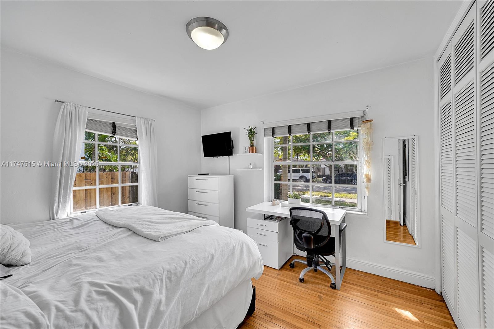 2271 Southwest 24th Terrace Miami, FL 33145 - Photo 9 of 23 a bedroom with a bed and a desk