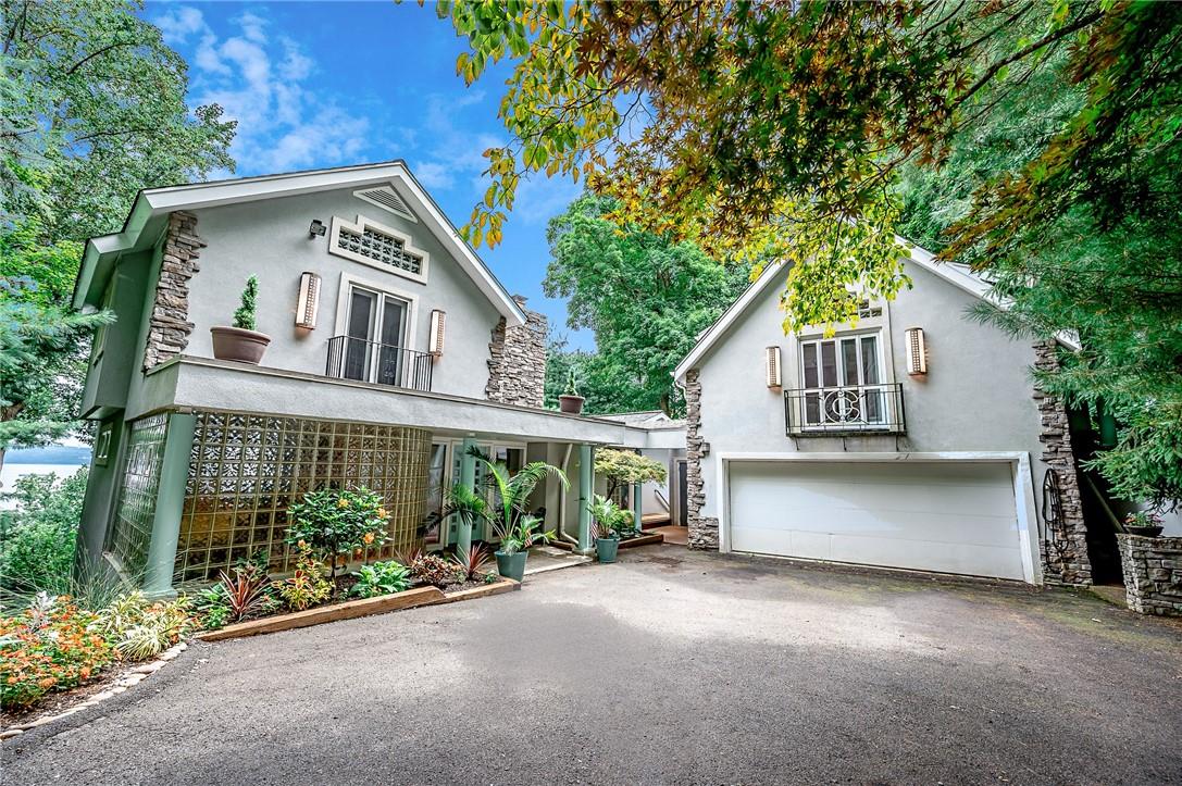 a view of a house with a yard and plants