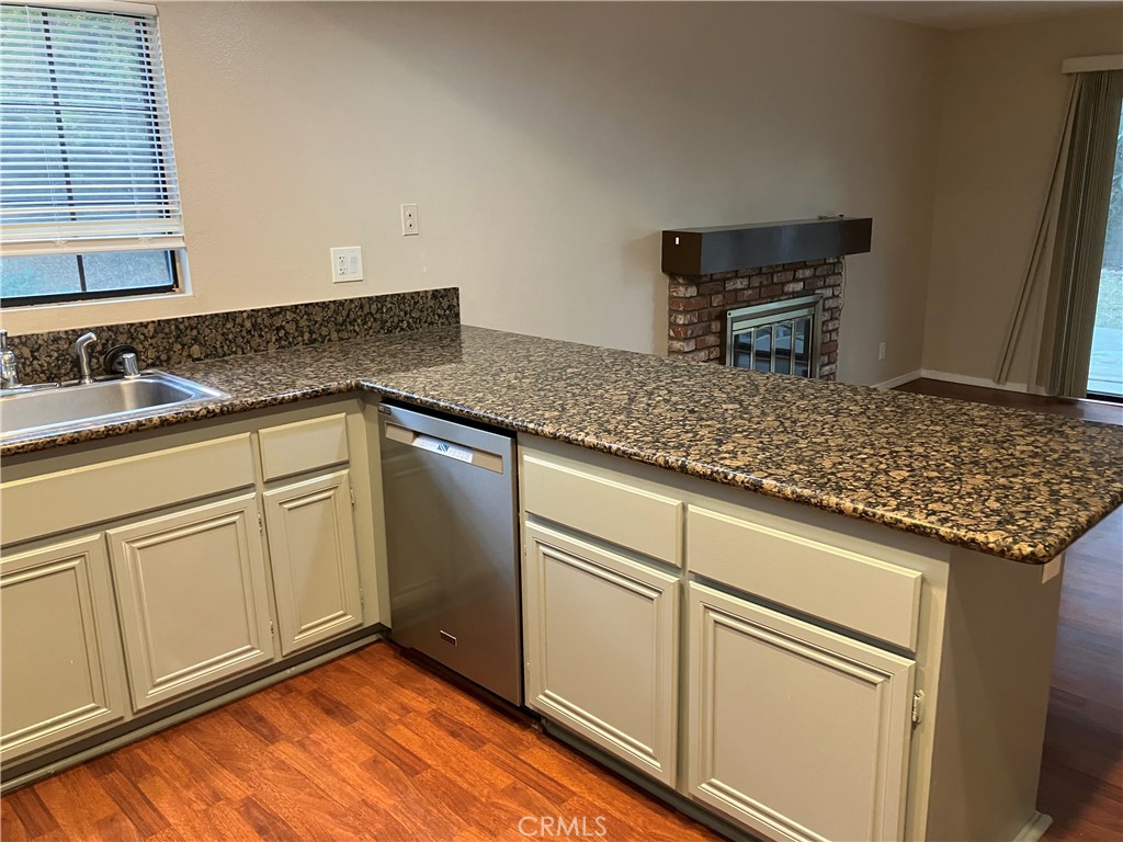 19933 Ralph Street Walnut, CA 91789 - Photo 23 of 77 a kitchen with granite countertop cabinets stainless steel appliances and sink