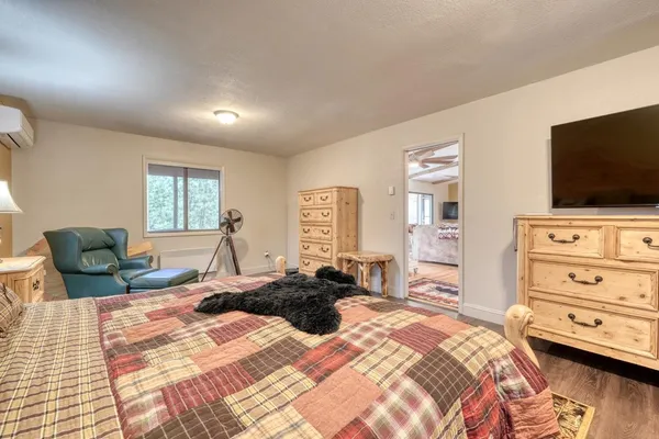 a bed room with a bed and furniture