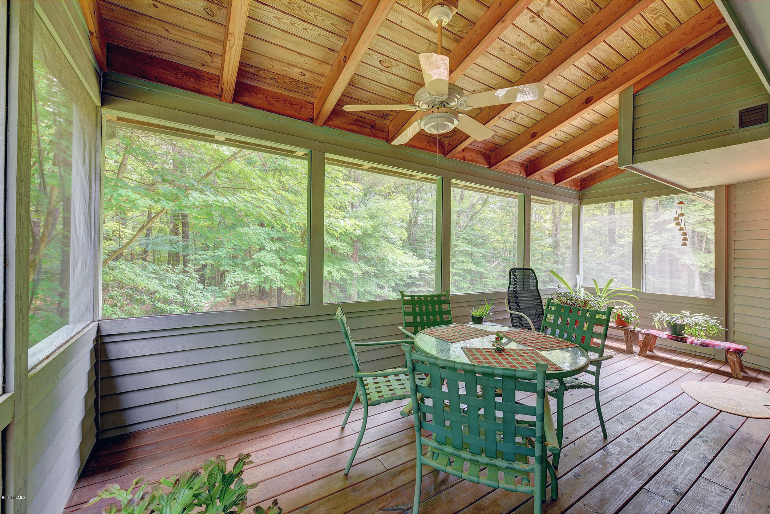 26 Harrington Road Otis, MA 01253 - Photo 22 of 37 a view of a patio with table and chairs and wooden floor