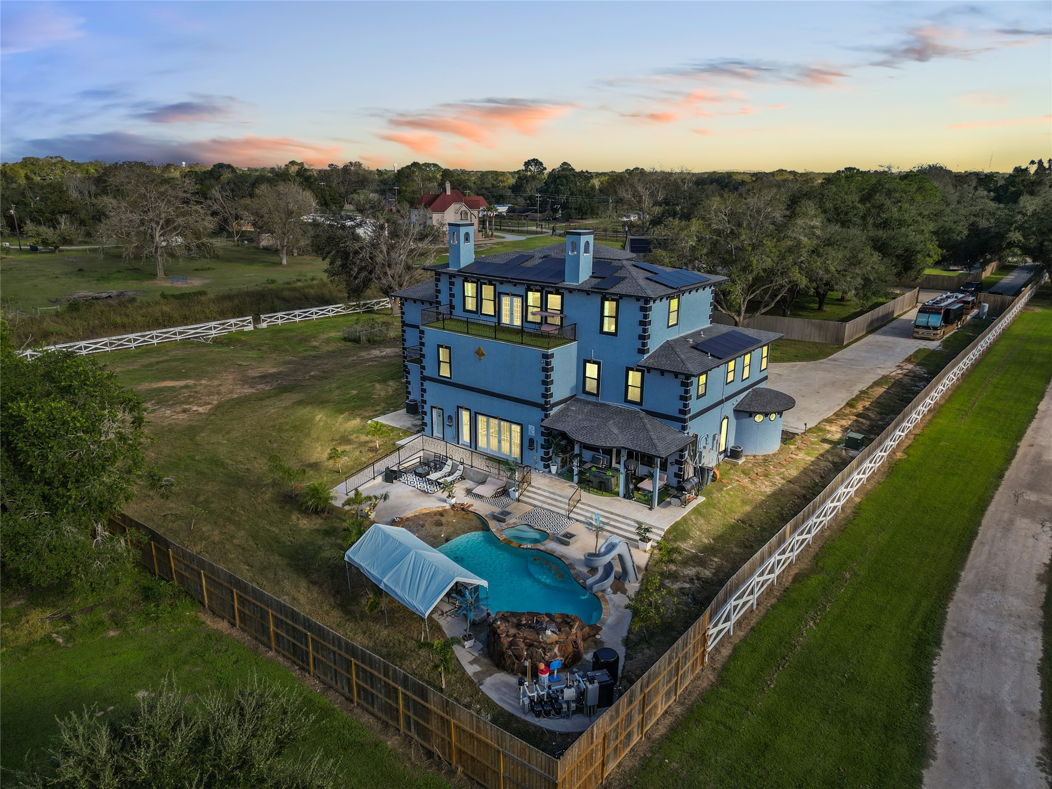 1259 County Road 147 Alvin, TX 77511 - Photo 3 of 49 Twilight aerial ,looking toward the back of estate.