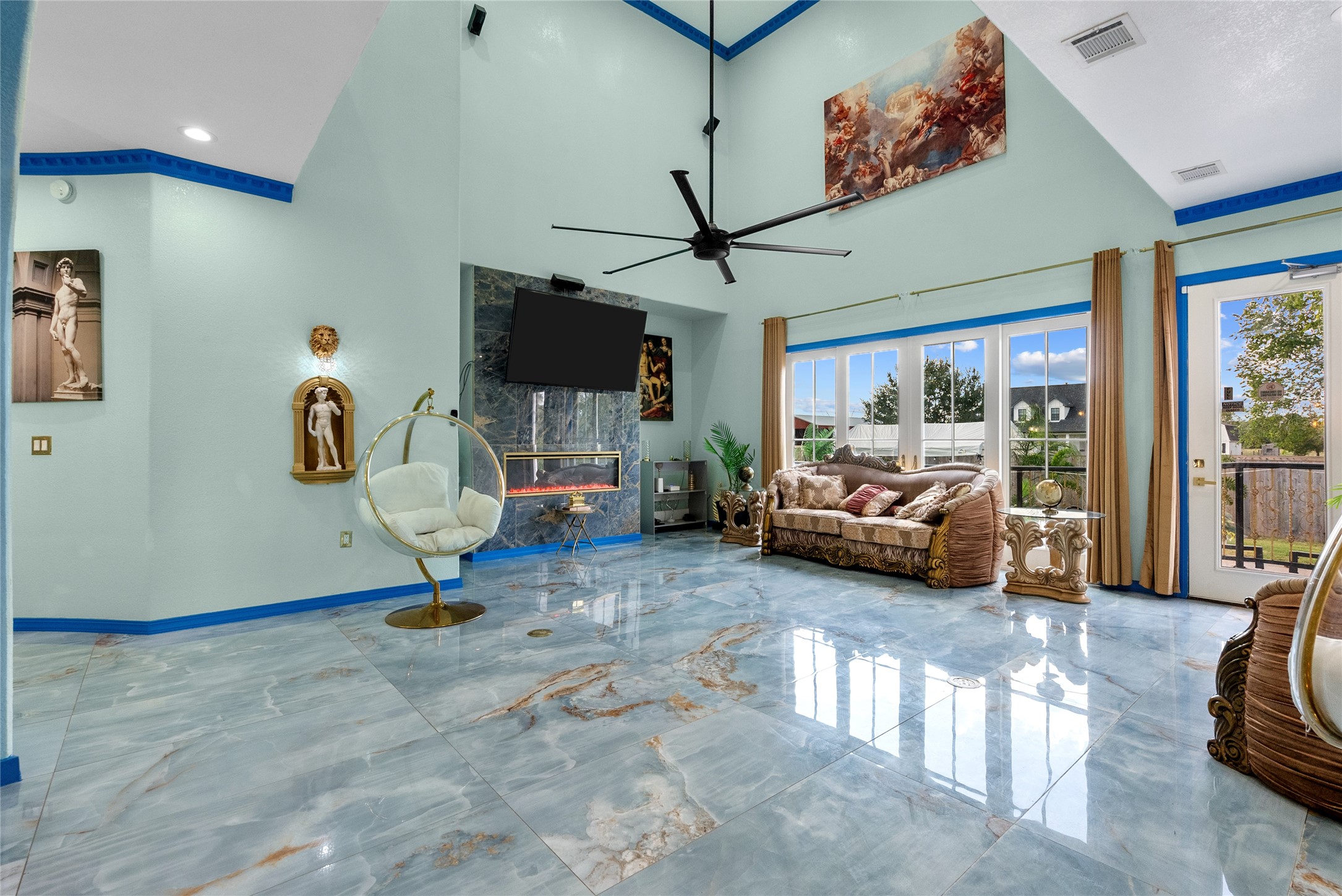 1259 County Road 147 Alvin, TX 77511 - Photo 7 of 49 Living area features ceiling fans, electric fireplace, and open concept to back yard.