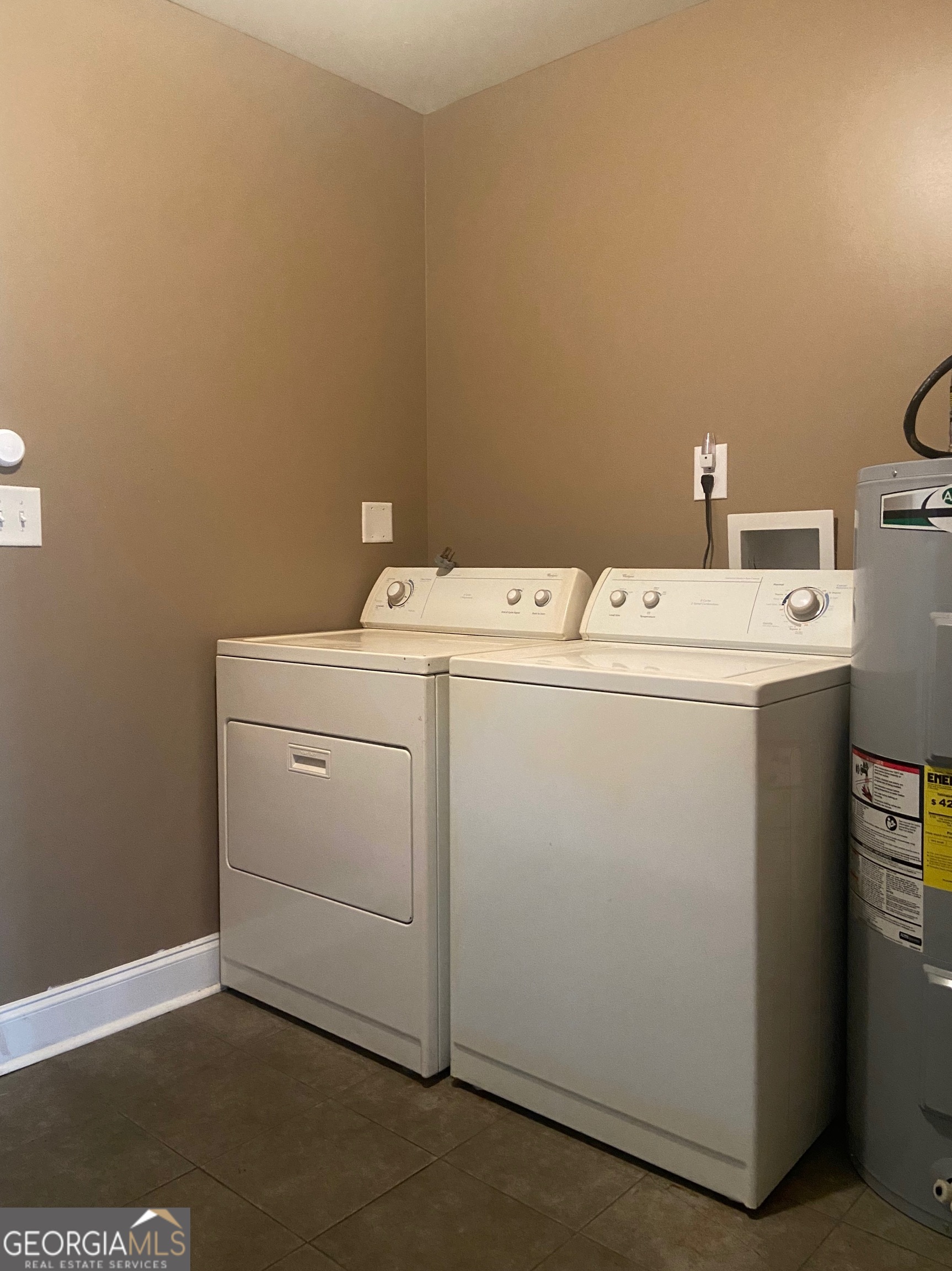 103 A Ronald Pride Boulevard Fort Valley, GA 31030 - Photo 3 of 9 a utility room with dryer and washer