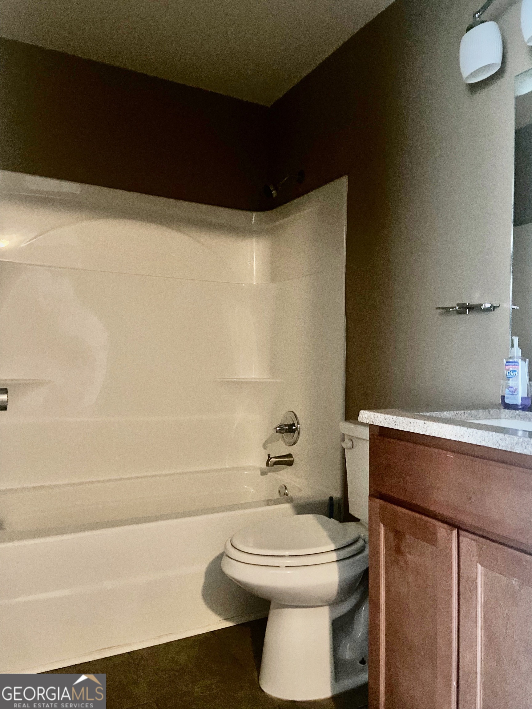 103 A Ronald Pride Boulevard Fort Valley, GA 31030 - Photo 5 of 9 a bathroom with a toilet a sink and bathtub