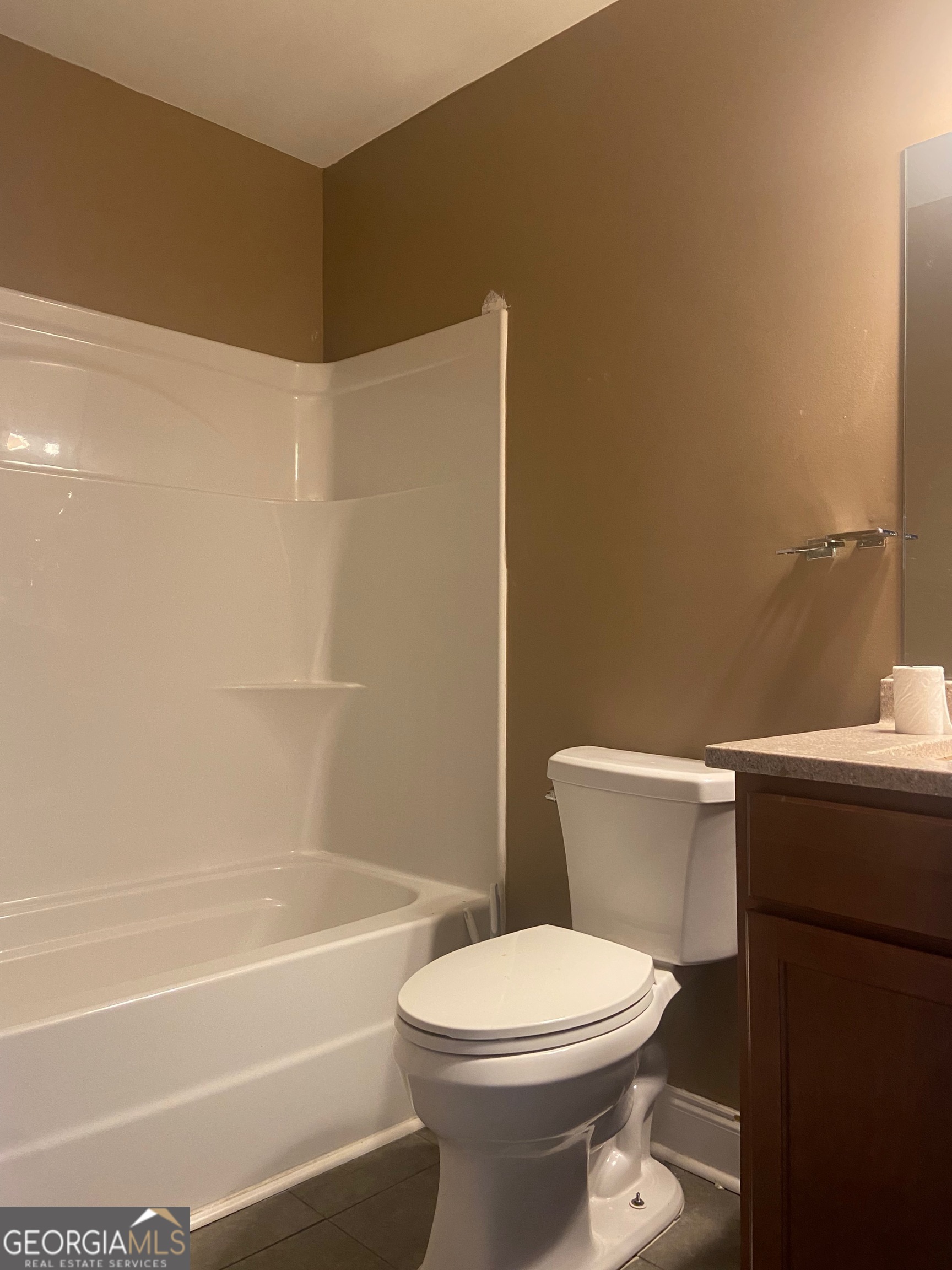 103 A Ronald Pride Boulevard Fort Valley, GA 31030 - Photo 9 of 9 a bathroom with a toilet and a bathtub