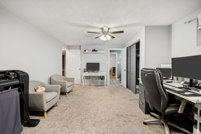 1215 8th Street Ogden, UT 84404 - Photo 26 of 39 Carpeted interior room featuring light gray wall paint and a ceiling fan with light fixture